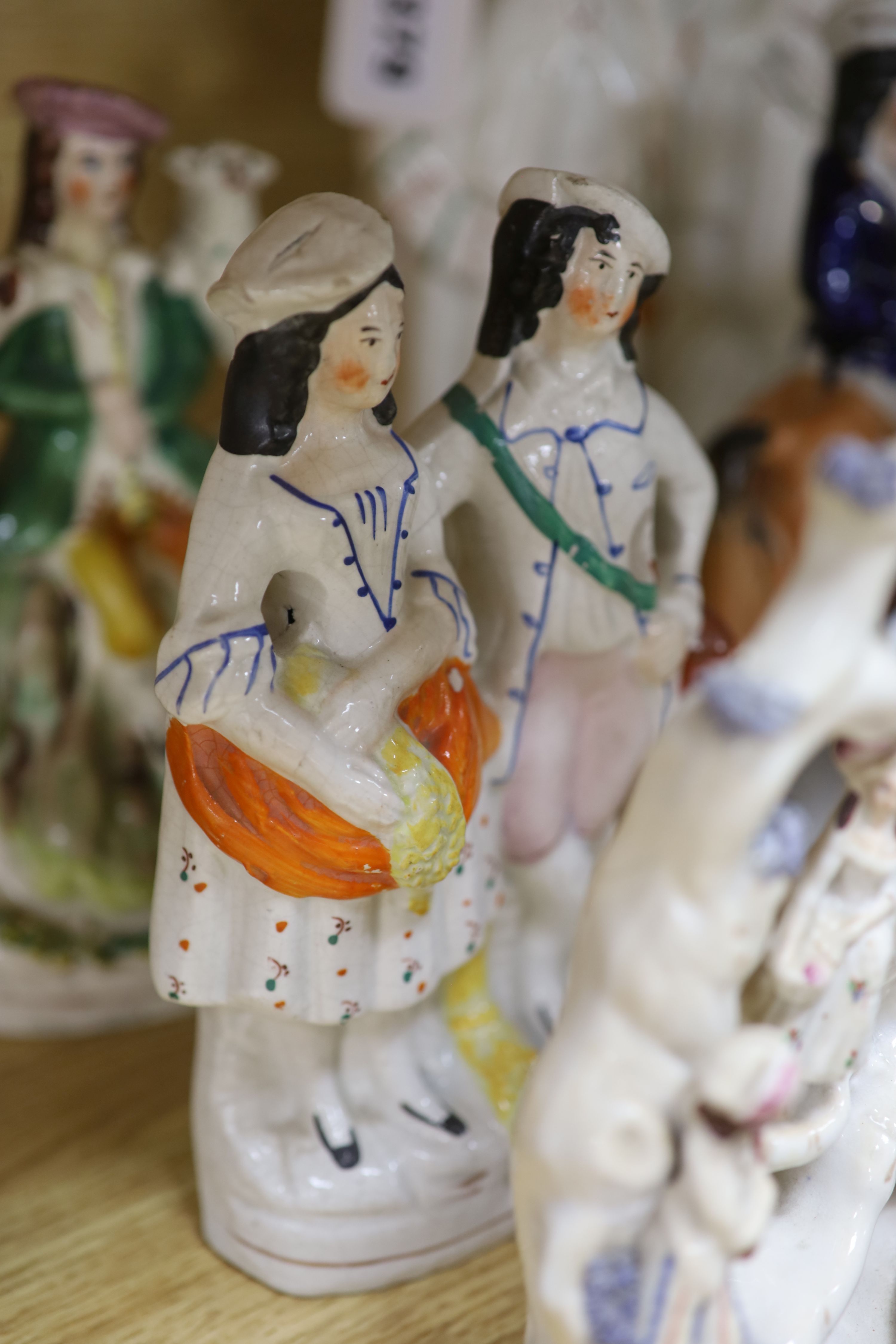 A collection of assorted Staffordshire figures and sundry ceramics including mid 18th century Staffordshire deer, tallest 33cm